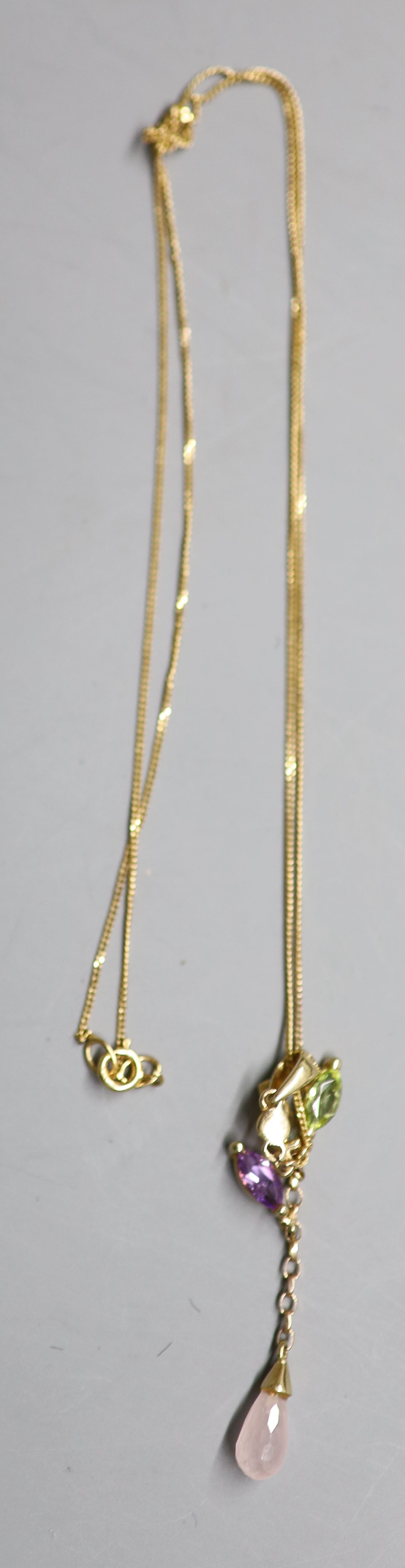 A modern 9ct gold and multi gem set drop pendant, 38mm, on a 9ct gold fine link chain (knotted), gross 1.7 grams.